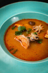 Tom yang with seafood on a table