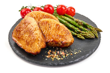 Grilled pork steaks with asparagus, isolated on white background. High resolution image