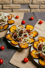 potatoes and grilled shish kebab on a plate