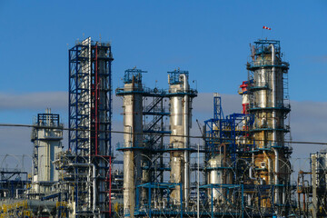 Fototapeta na wymiar Corps of Moscow refinery in spring in clear weather