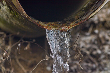 Water flows from the pipe