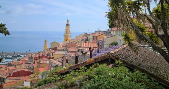 Beautiful Menton Old Town On The French Riviera, Elevated Aerial View Over Rooftops, Spring Flowering Trees, France Europe - DCi 4K Resolution
