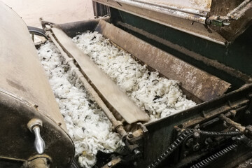 Old wool processing machine. Carding of wool equipment