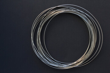 Educational kinetic rings, anti stress toy for children and teenagers on black background. The development of neuroplasticity of the brain, emotions and feelings.