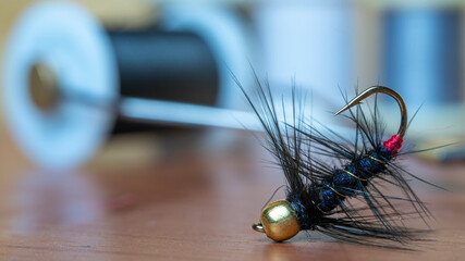 Close up of a fly fishing fly. Hand made fly for fishing.