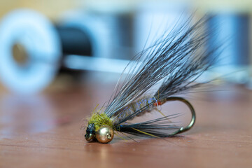 Close up fly fishing fly. Handmade trout fishing fly