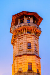 Fototapeta na wymiar Old water tower in Chisinau at dusk, Moldova