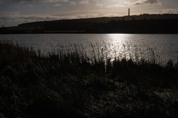 Silhouette of the Wellington Monument Unnamed Loch near Kelso in Roxburghshire, Scotland