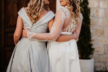 bride and maid of honor wedding day