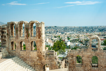 Fototapeta na wymiar Odeon of Herodes Atticus, view of the ancient building and modern Athens, Athens, Greece