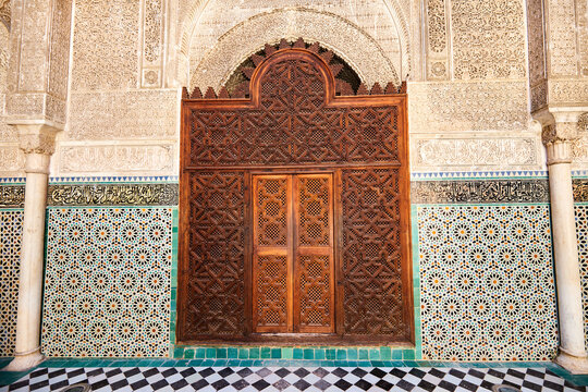 Elaborately decorated gate to a Medieval Medressa - spiritual school in Fez, Morocco