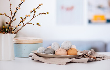 Easter background with eggs and spring branches. Happy Easter. Table setting. Holidays background.