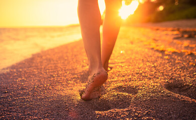 person walking on the beach
