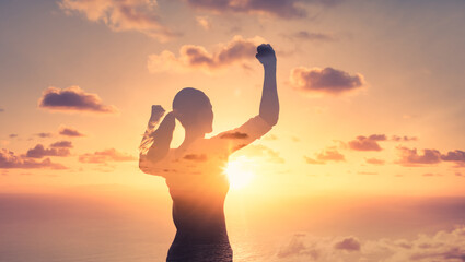 Strong confident, and fit woman flexing her arms up to the sky. People power, and strength concept. 