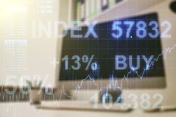 Multi exposure of abstract financial graph and modern desktop with pc on background, financial and trading concept