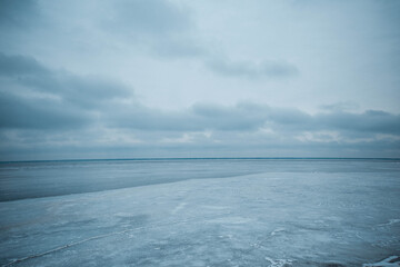 Fototapeta na wymiar Empty snow land. Gray sky and ice 