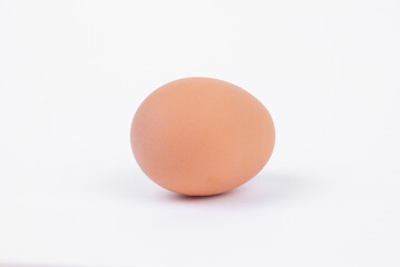 Egg on a white background. Yellow chicken egg