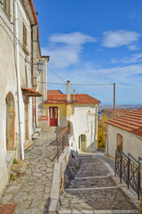 A narrow street among the old houses of Monteverde, a medieval village in the province of Avellino.