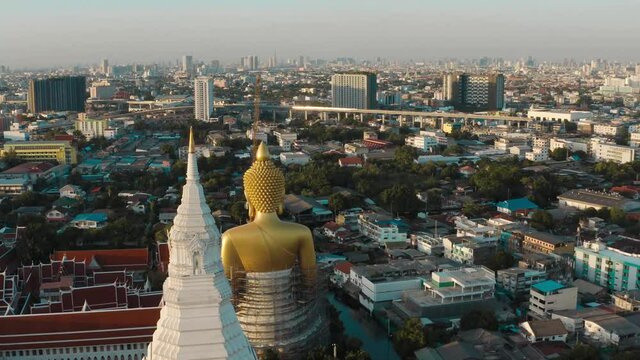 Aerial view of Wat Paknam Bhasicharoen, a temple, pagoda and Buddha statue in Bangkok Thailand. High quality 4k footage