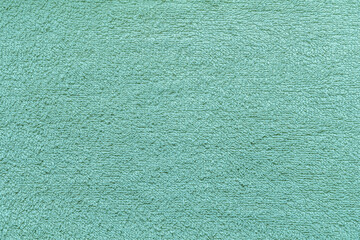 abstract background of turquoise terry towel close up