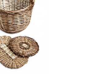 Fototapeta premium Wicker basket and bottoms for baskets isolated on white background