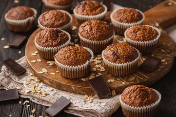 Homemade oat flakes muffins with peanut butter and chocolate.