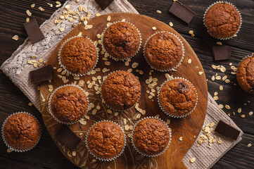 Homemade oat flakes muffins with peanut butter and chocolate.