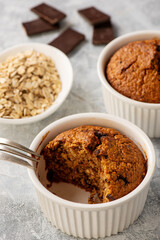 Homemade oat flakes muffins with peanut butter and chocolate.
