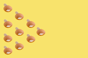 Minimal funny Easter layout with flying eggs on yellow background