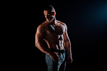 Fototapeta na wymiar Powerful strong man with muscular bodybuilder
