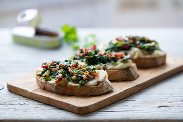 Crostini with white bean and potato puree and Swiss chard