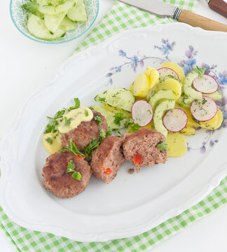 Meatball with potato cucumber and radish salad