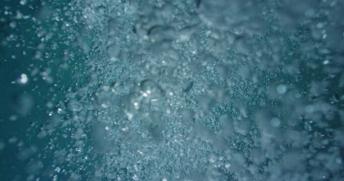 Blue water bubbles underwater
