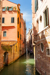 20 August 2019 - Venice, Italy. View of a narrow beautiful canal in Venice