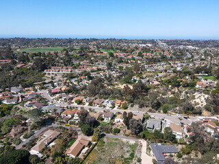 Fototapeta premium Aerial view of Rancho Santa Fe neighborhood with big mansions with pool in San Diego, California, USA. Aerial view of residential modern luxury house.