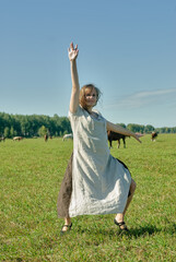 Attractive girl dance on meadow