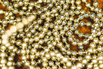Shiny Golden beads background and close-up