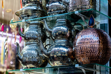 Arab souvenir shop with copper utensils: teapots, coffee pots and other utensils