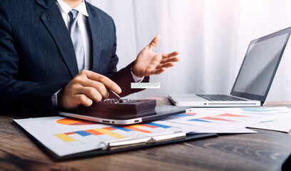 Fototapeta premium Digital marketing media in virtual screen.businesswoman hand working with mobile phone and modern compute with VR icon diagram at office in morning light