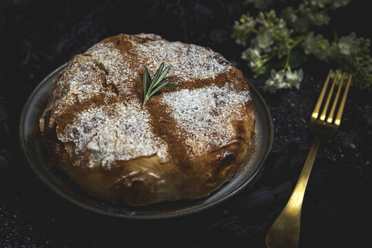 From above of appetizing bastilla with aromatic spices on table near flower sprig during Ramadan holidays