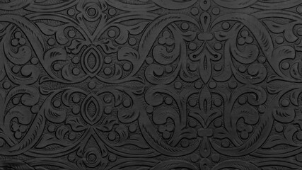 Textured black metal backdrop with ancient oriental floral wavy ornament. Background floral carved silver black, decorative asian religious chasing art.