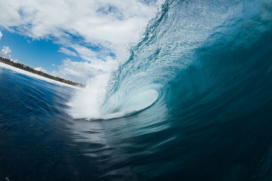 Powerful foamy sea waves rolling and splashing over water surface against