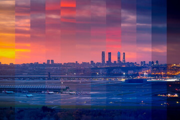 Contemporary multistory building facades against airplanes on road under colorful sky in twilight in Madrid Spain