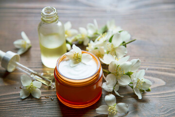 Obraz na płótnie Canvas Natural skin care facial cream with jasmine oil, organic skincare products