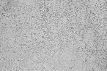 texture of grey wall covered with volumetric plaster, space for text, space for copy