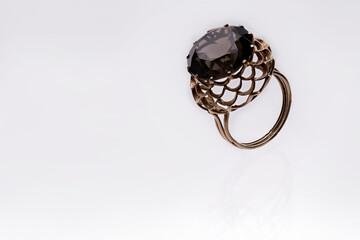 Unique design of a luxury gold ring with a big red ruby stone