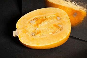 sliced spaghetti squash on black background