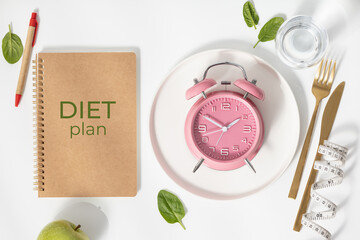 Composition with cutlery, measuring tape, diet plan and alarm clock on color background. Diet concept, copy space