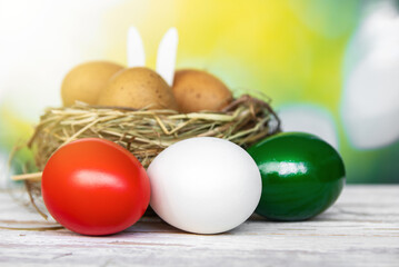 Happy Easter holiday text in italian card, Easter eggs as the color of the Italian flag - green, white, red
