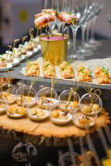 Catering service. Table with snacks food at event.